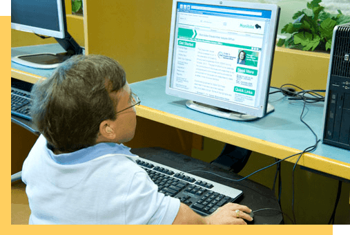 A person sits at a computer